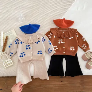 Detailed shot of toddler girls knit cardigan set with cherry print, lapel collar and sweet style.