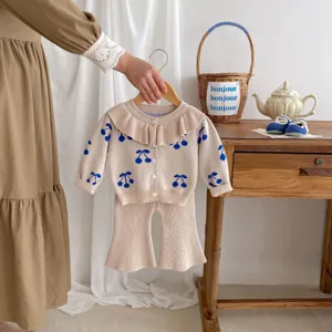 Infant baby girl knit cardigan and flare pants set with cute blue cherry print and ruffle collar.
