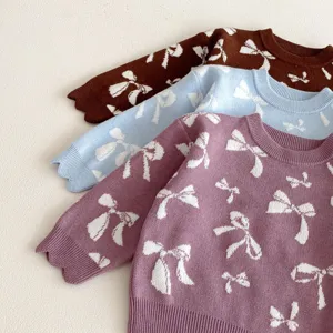 Girls knit sweater with cute bow jacquard pattern, soft long sleeve pullover top detail.