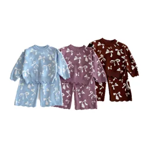 Girls knit sweater and pants set with cute bow jacquard pattern, comfortable winter outfit.