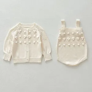 Cozy baby knit cardigan and romper set with charming pom-pom and hollow-out design.
