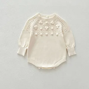 Cute baby girl knitted romper with hollow-out design and cute pom-poms for autumn winter.