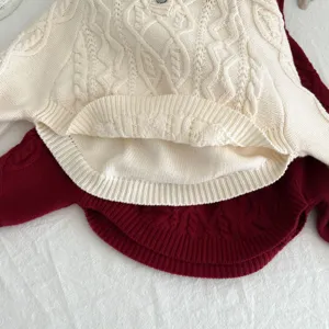 Detailed view of the toddler cable knit hooded sweater, showing fine texture and cozy fabric.