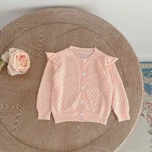 Girls pink knit cardigan, cute ruffle shoulder with flower buttons and delicate knit fabric.