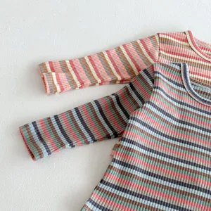 Detailed view of children colorful striped long sleeve shirt fine knit fabric texture