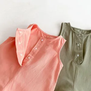 Infant cotton sleeveless top detail, soft fabric, snap button closure, comfortable wear.