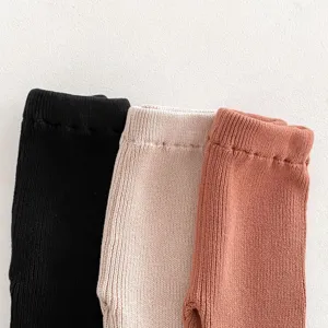 Infant knitted cotton flare pants detail, soft toddler leggings in multiple colors.