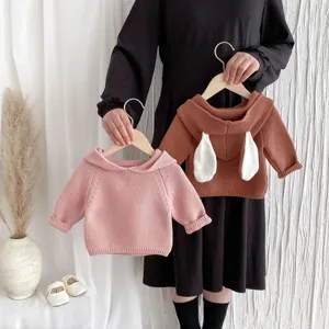 Cute baby knitted sweater with bunny ears, hooded pullover design, soft infant autumn top.