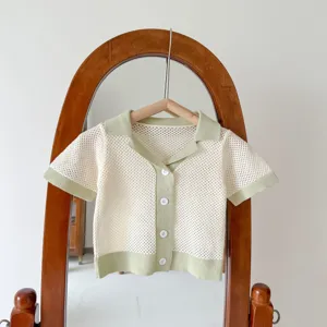 Detail view of infant knitted cardigan, hollow-out design, perfect for summer daily wear.