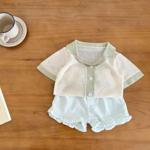 Infant summer knit cardigan and ruffled shorts set, fine hollow mesh fabric, detail view.