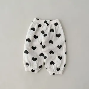 Infant gauze anti-mosquito pants with cute black heart print, soft breathable baby wear.