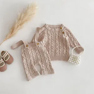 Infant baby knit cable sweater and cute suspender pants set in beige detail view.