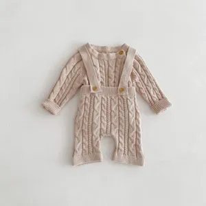Baby cable knit romper, cute long sleeve infant jumpsuit with wooden buttons, cozy detail view.
