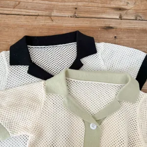 Infant knit air-conditioning cardigan detail showing fine hollow-out cotton yarn texture and polo collar.