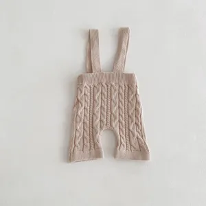 Baby cable knit suspender shorts detail view, cute infant daily wear apparel item.
