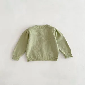 Back detail display of light green baby knit cardigan, featuring soft cotton yarn long sleeves.