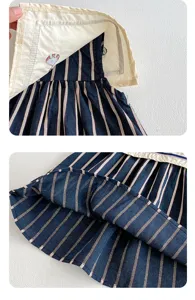 Primer plano del bordado del cuello y la tela de rayas del vestido de verano, gran detalle.