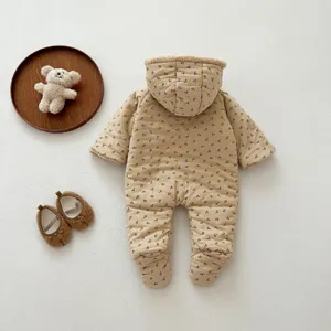 Cozy detail shot of winter baby hooded romper featuring soft plush hood and cute pattern.