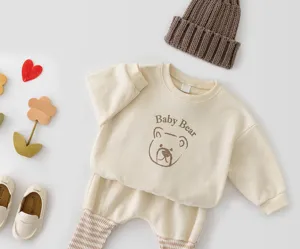Cute baby bear sweatshirt and harem pants set with knit hat, perfect for spring toddler wear.
