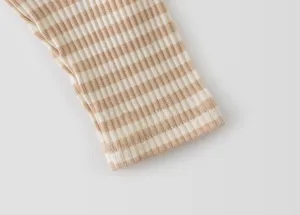 Infant children striped ribbed knit cuff detail, soft texture apparel fabric close-up view