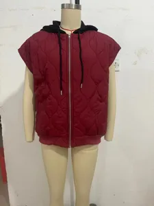 Detailed view of the sleeveless quilted hooded vest showcasing texture and zipper.