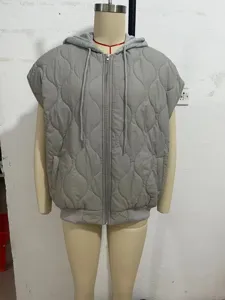 Grey quilted sleeveless hooded vest, casual zip-up outerwear with drawstring detail.