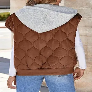 Back view detail of the brown quilted sleeveless hooded vest, showing texture and matching style.