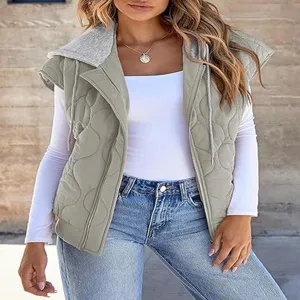 Close up detail of the stylish quilted sleeveless hooded vest layered over white long sleeve top.