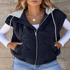 Close-up detail of the black quilted sleeveless hooded vest with contrast grey drawstring hood.