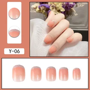 Press-on false nails set featuring blush gradient and silver glitter edge details.