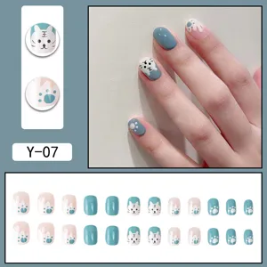 Blue and white press-on nails with cute cartoon cat tiger design and full set display.