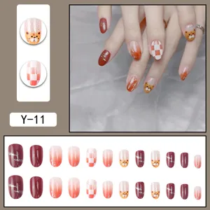Detail view of press-on false nails featuring gradient, cat eye, and cute tiger patterns.
