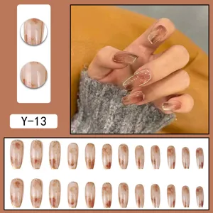 Press-on false nails set with blush gradient and cat eye design for women daily manicure style.