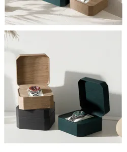 Dettaglio scatola orologi esagonale, finitura legno e presentazione verde elegante.