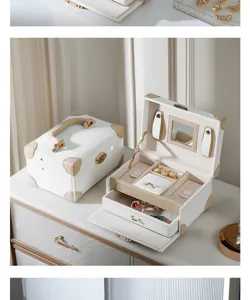 White leather jewelry box with mirror, double-layer portable storage case for rings and necklaces.