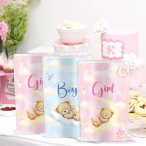 Detailed view of cartoon teddy bear gender reveal favor bags in pink and blue colors.