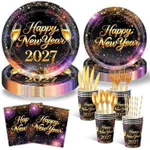 Black gold New Year party tableware set with fireworks plates cups napkins for celebration.