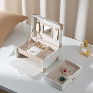 Elegant double layer leather jewelry box with mirror, lock, and drawer for desktop storage.