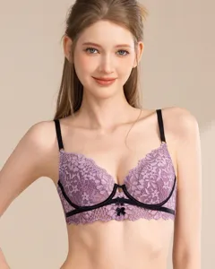 Detailed view of women's purple lace bra featuring delicate floral patterns and black straps.