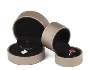 Round brushed leather jewelry box set, elegant round storage case for rings and necklaces.