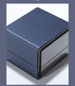 Blue brushed PU leather LED jewelry gift box for secure ring pendant and bracelet storage.