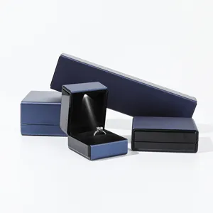 Blue LED jewelry box with light for ring pendant and bracelet storage display setup.