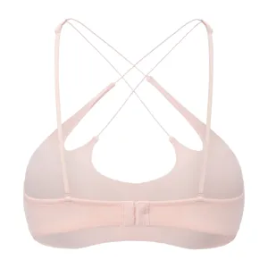 Detailed view of women's sexy wireless strappy back bra in pink with thin cross straps.