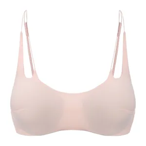Detailed view of wireless thin cup pink bra featuring delicate cross shoulder straps