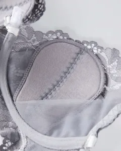 Detailed view of the grey lace bra interior showing breathable mesh and fine stitching work.