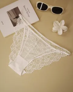 Detailed shot of delicate French lace panties showcasing intricate floral patterns and soft straps.