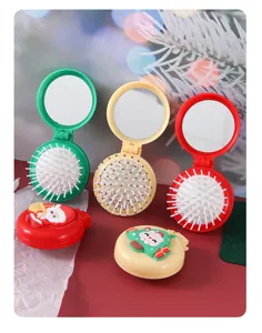 Portable folding air cushion hairbrush with compact mirror, cute Christmas gift design.