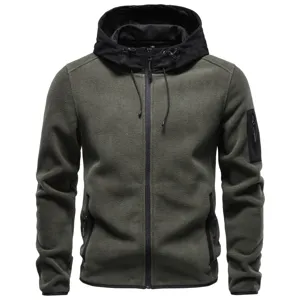 Detailed view showing the sleeve zipper pocket and contrast hood of the warm fleece jacket.