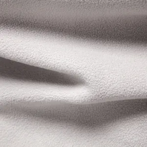 Detailed view of soft light gray fleece fabric texture showing premium plush quality.