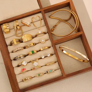 Gold-plated stainless steel rings and bracelet jewelry set featuring sparkling zircon stones for women.